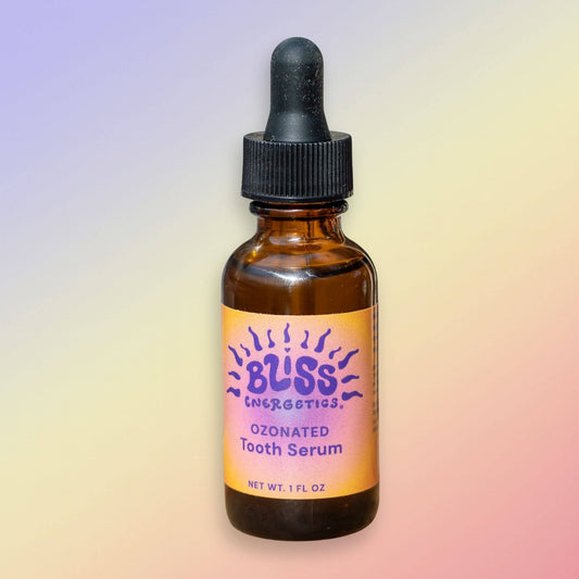 Bliss Energetics Tooth Serum, a nutrient-rich oil with herbal extracts to nourish teeth and gums.