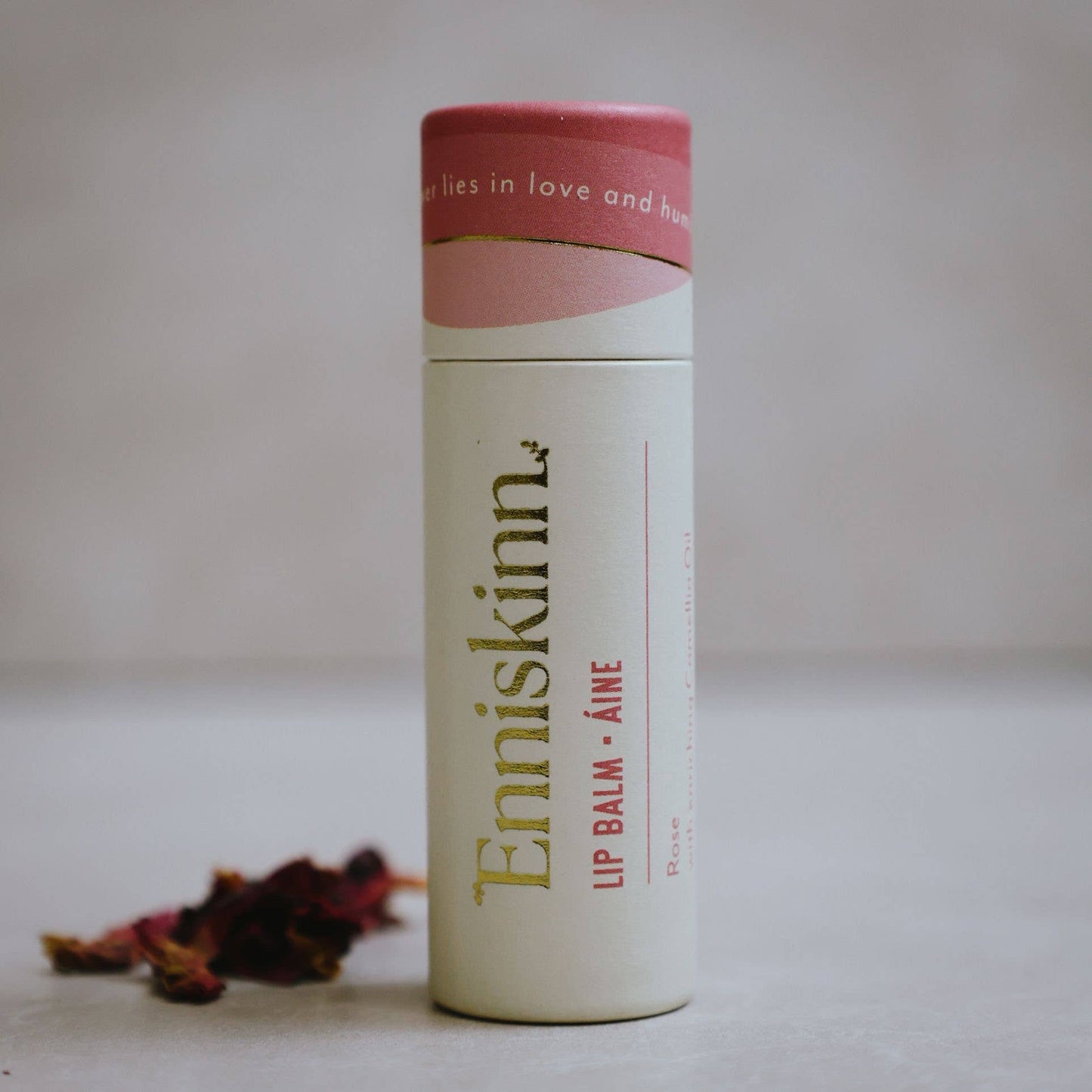Enniskinn Aine rose-scented lip balm in a zero-waste paper tube.